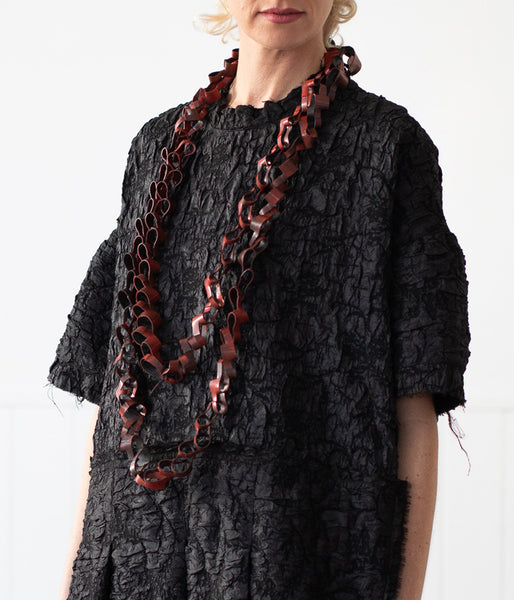 Laser cut rubber necklace sale